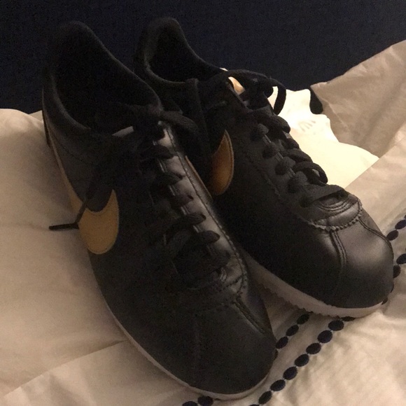 nike cortez black and gold womens